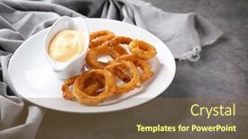  Presentation with onion - Amazing PPT theme having plate with fried onion rings and sauce on table backdrop and a tawny brown colored foreground