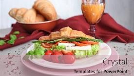  Presentation with croissant - Slides enhanced with plate with tasty croissant sandwich on table background and a coral colored foreground