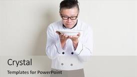  Presentation with asian food - Presentation theme consisting of portrait of 50s mature asian male chef in uniform presenting dish and smelling the aroma empty plate ready for food standing on plain background with shadow copy space background and a light gray colored foreground