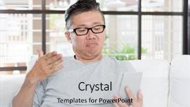  Presentation with smart home - Presentation enhanced with portrait of 50s mature asian man with negative face expression while using smart phone sitting on sofa at home background and a light gray colored foreground