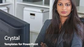  Presentation with woman office desk - PPT theme with portrait of a beautiful powerful young asian indian woman or businesswoman in office sitting at a desk arms folded with a computer background and a dark gray colored foreground