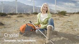  Presentation with trekking - Audience pleasing slide deck consisting of portrait of a beautiful senior woman with trekking pole and bag sitting at wind farm backdrop and a coral colored foreground