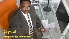  Presentation with paperwork - Colorful PPT theme enhanced with portrait of a businessman with paperwork at computer desk backdrop and a tawny brown colored foreground