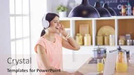  Presentation with computer music - Presentation design featuring portrait of a cheerful young woman listening to music with headphones and using laptop computer while standing at the kitchen background and a lemonade colored foreground