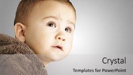  Presentation with brown bear - Theme consisting of portrait of a handsome kid wearing a brown bear sweatshirt and looking up background and a light gray colored foreground