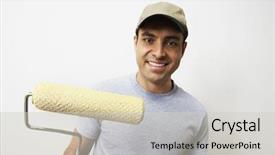  Presentation with paint roller - Audience pleasing theme consisting of portrait of a happy man holding paint roller backdrop and a soft green colored foreground