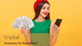  Presentation with mobile money - PPT theme having portrait of a pretty young woman dressed in beret and green dress holding bunch of money banknotes and using mobile phone isolated over yellow background background and a yellow colored foreground