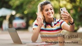  Presentation with computer music - Audience pleasing theme consisting of portrait of a smiling young teenage girl sitting at the table with laptop computer at the park listening to music with headphones using mobile phone to take selfie peace gesture backdrop and a coral colored foreground