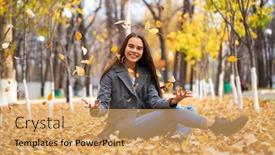  Presentation with autumn blue - Slide set featuring portrait of a young beautiful girl in blue jeans and gray coat sits on autumn leaves in a park background and a yellow colored foreground
