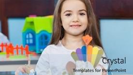  Presentation with craft - Theme having portrait of cute little girl with craft on desk in classroom background and a light blue colored foreground