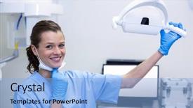  Presentation with dental assistant - Audience pleasing theme consisting of portrait of dental assistant adjusting backdrop and a light blue colored foreground