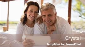  Presentation with using digital tablet - Presentation theme consisting of portrait-of-happy-couple-using background and a coral colored foreground