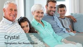  Presentation with living room family - Amazing PPT theme having portrait of happy family sitting on sofa in their living room backdrop and a light blue colored foreground