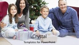  Presentation with children parents - Beautiful PPT theme featuring portrait of happy parents and children with presents sitting in front of christmas tree backdrop and a light blue colored foreground