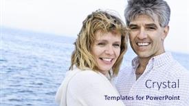  Presentation with seashore - PPT theme enhanced with portrait of mature romantic couple at seashore background and a sky blue colored foreground