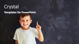  Presentation with forefinger - Cool new slides with portrait of smiling small boy showing forefinger against school blackboard background backdrop and a dark gray colored foreground