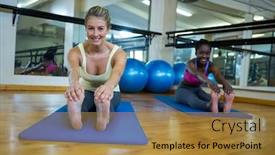  Presentation with exercise mat - PPT layouts enhanced with portrait of two smiling women doing stretching exercise on mat in fitness studio background and a gold colored foreground