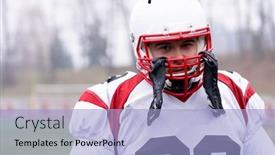  Presentation with football field - Cool new PPT theme with portrait of young confident american football player standing on the field during training backdrop and a light blue colored foreground