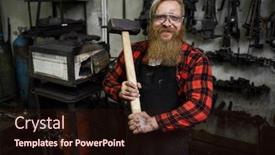  Presentation with apron - Presentation theme enhanced with positive confident strong male blacksmith in protective eyewear and apron holding big hammer for shaping metal and looking at camera in workshop background and a wine colored foreground