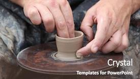  Presentation with clay - Amazing PPT theme having potter hands creating jar backdrop and a tawny brown colored foreground