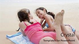  Presentation with teen girls - Amazing presentation theme having pre-teen girls lying side by side on stomach on beach towel on sandy beach talking backdrop and a coral colored foreground