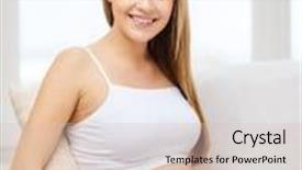  Presentation with motherhood - Cool new theme with pregnancy motherhood and happiness concept - happy pregnant woman sitting on sofa and touching her belly backdrop and a soft green colored foreground