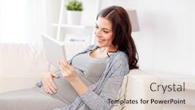  Presentation with motherhood - Amazing theme having pregnancy motherhood technology people and expectation concept - happy pregnant woman with tablet pc computer at home backdrop and a lemonade colored foreground