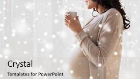  Presentation with tea cup - Amazing theme having pregnancy people winter christmas and expectation concept - close up of happy pregnant woman with cup drinking tea looking through window at home over snow backdrop and a light gray colored foreground