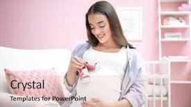  Presentation with baby shoes - Colorful slide deck enhanced with pregnant woman holding baby shoes backdrop and a lemonade colored foreground