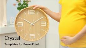  Presentation with pregnant woman - Presentation design enhanced with pregnant woman holding wall clock background and a soft green colored foreground
