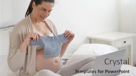 Presentation with baby clothes - Presentation theme with pregnant woman showing baby clothes through laptop video camera background and a light gray colored foreground