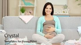  Presentation with baby clothes - Beautiful presentation design featuring pregnant woman sitting on sofa backdrop and a soft green colored foreground