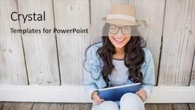  Presentation with bleached - Theme with pretty hipster sitting on ground with tablet against bleached wooden fence background and a soft green colored foreground