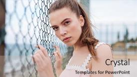  Presentation with chain link fence - PPT layouts having pretty young woman standing outdoors near chain link fence background and a soft green colored foreground