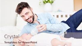  Presentation with baby milk - Slide set consisting of proud and happy father gives baby the bottle with milk at home background and a lemonade colored foreground