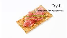  Presentation with cracker - Beautiful slides featuring pumpkin seed cracker with dry salami and chives on white background backdrop and a pink colored foreground