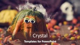  Presentation with skull - Audience pleasing slides consisting of pumpkin with funny eyes surrounded by halloween candies on a rustic wooden table and a skull in the background backdrop and a tawny brown colored foreground