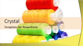  Presentation with thread - Beautiful theme featuring pyramid of many-coloured bobbins of thread isolated on white backdrop and a yellow colored foreground
