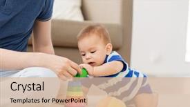  Presentation with baby toy - Slide deck having pyramids - family fatherhood and childhood concept background and a soft green colored foreground