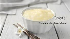  Presentation with pudding - PPT theme having ramekin with tasty vanilla pudding on table background and a soft green colored foreground