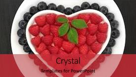  Presentation with blueberry - Audience pleasing theme consisting of raspberry and blueberry fruit in a heart shaped bowl on a white round dish over black background backdrop and a red colored foreground