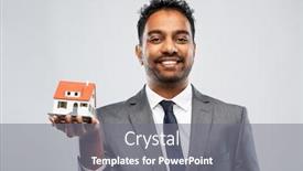  Presentation with realtor - PPT theme consisting of real estate business and people concept - indian man realtor with house model over grey background background and a gray colored foreground
