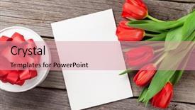  Presentation with greeting card - Theme with red tulips gift box and valentine's day greeting card top view with copy space background and a coral colored foreground