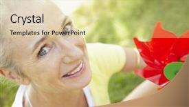  Presentation with toy cathone - Audience pleasing theme consisting of reminiscence summer - senior woman outdoors with toy backdrop and a blonde colored foreground