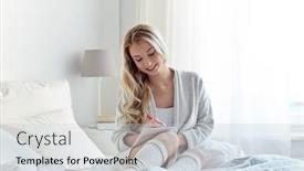  Presentation with writing pen - Theme consisting of rest sleeping comfort and people concept - happy young woman with pen and notebook writing in bed at home bedroom background and a light gray colored foreground