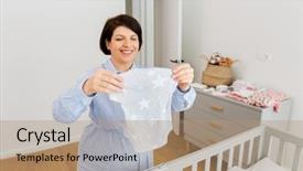  Presentation with baby clothes - Cool new theme with review - motherhood pregnancy and nursery concept backdrop and a coral colored foreground