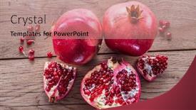  Presentation with pomegranate - Amazing PPT theme having ripe-pomegranate-fruits backdrop and a coral colored foreground