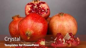 Presentation with pomegranates - Audience pleasing theme consisting of ripe pomegranates on wicker cradle on grey background backdrop and a tawny brown colored foreground