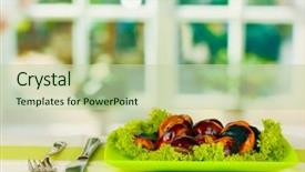  Presentation with tablecloth - Theme consisting of roasted chestnuts with lettuce in the plate on the tablecloth close-up background and a soft green colored foreground