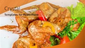  Presentation with roasted chicken - Audience pleasing theme consisting of roasted chicken wings garnished with fresh green salad pepper and greens backdrop and a yellow colored foreground